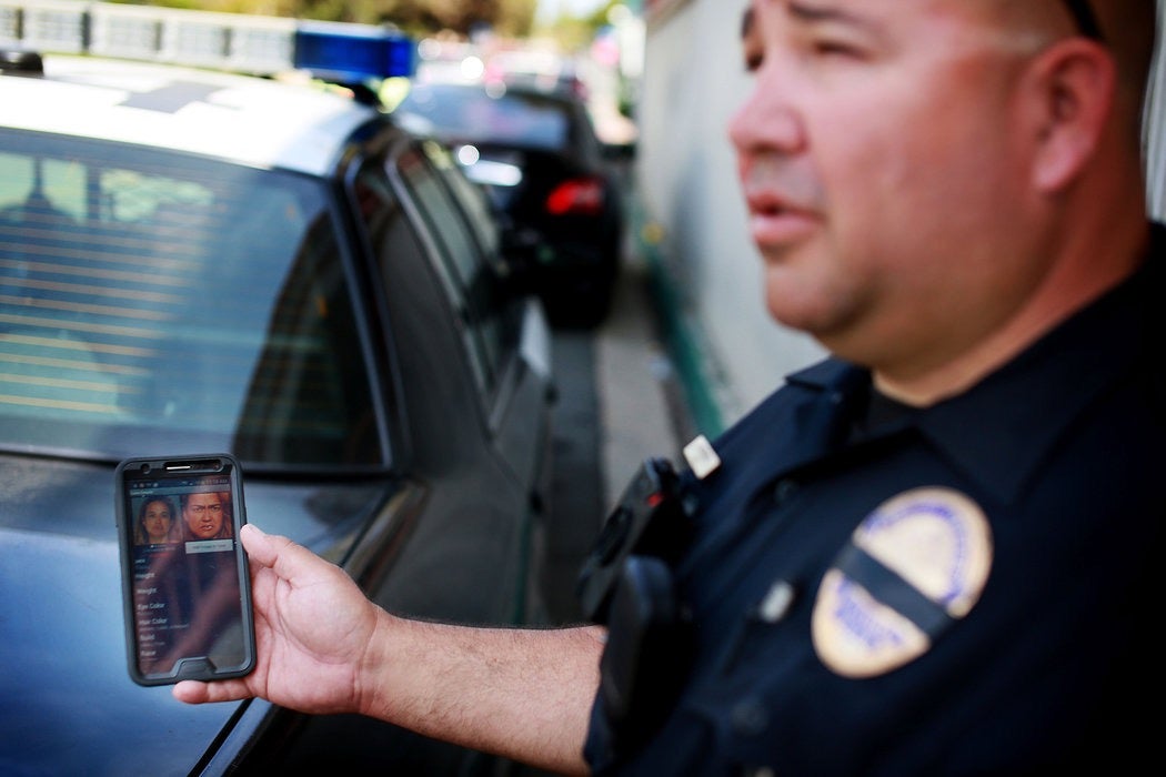 A California policeman displays a mobile face recognition app. (Photo: Sandy Huffaker/The New York Times/Redux)
